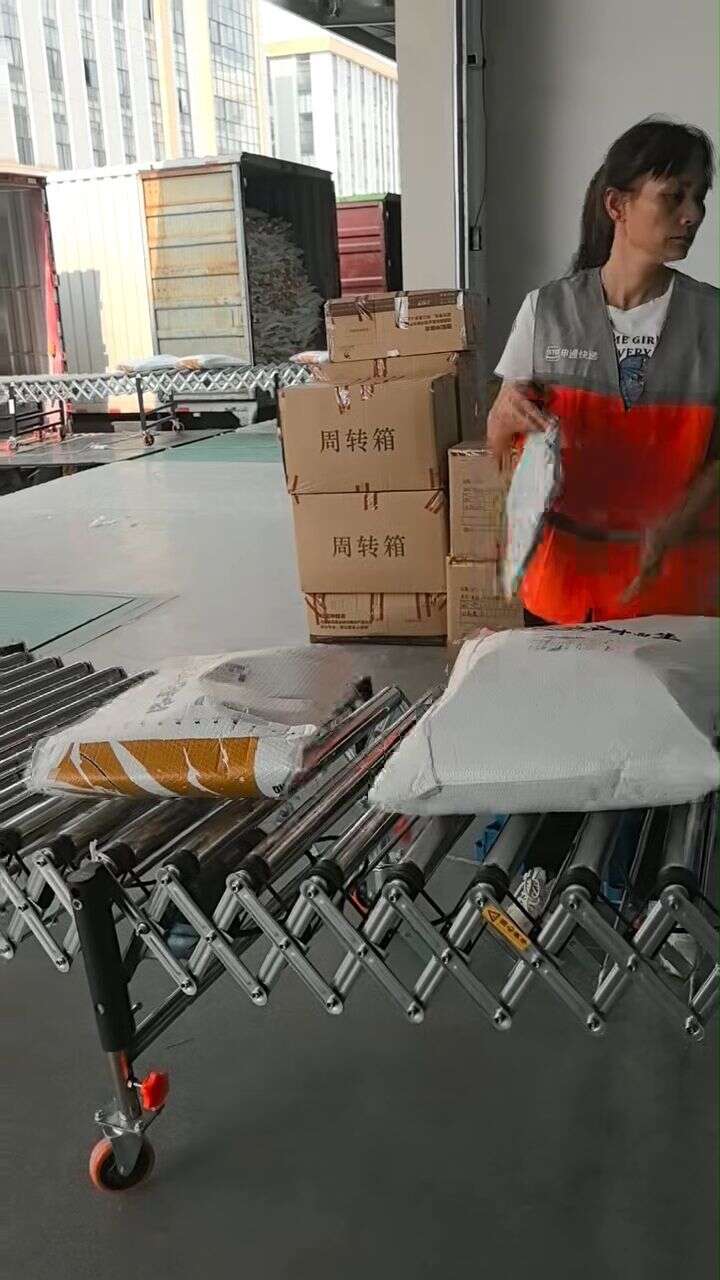 Loading and unloading platform at an express distribution center: Multi-Wedge Belt Powered Roller Conveyor connects outbound goods to last-stage transfer to trucks